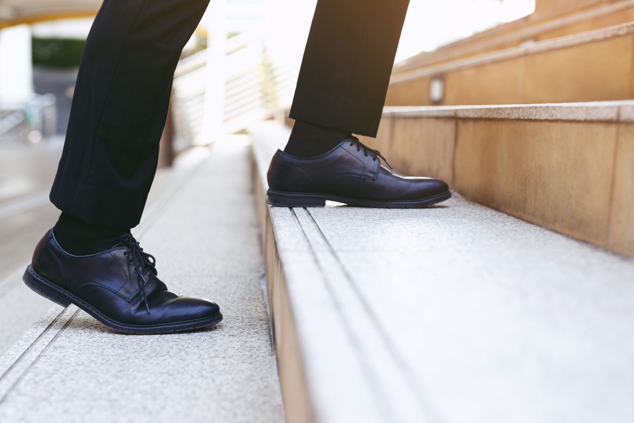 Broker Dealer walking up the stairs